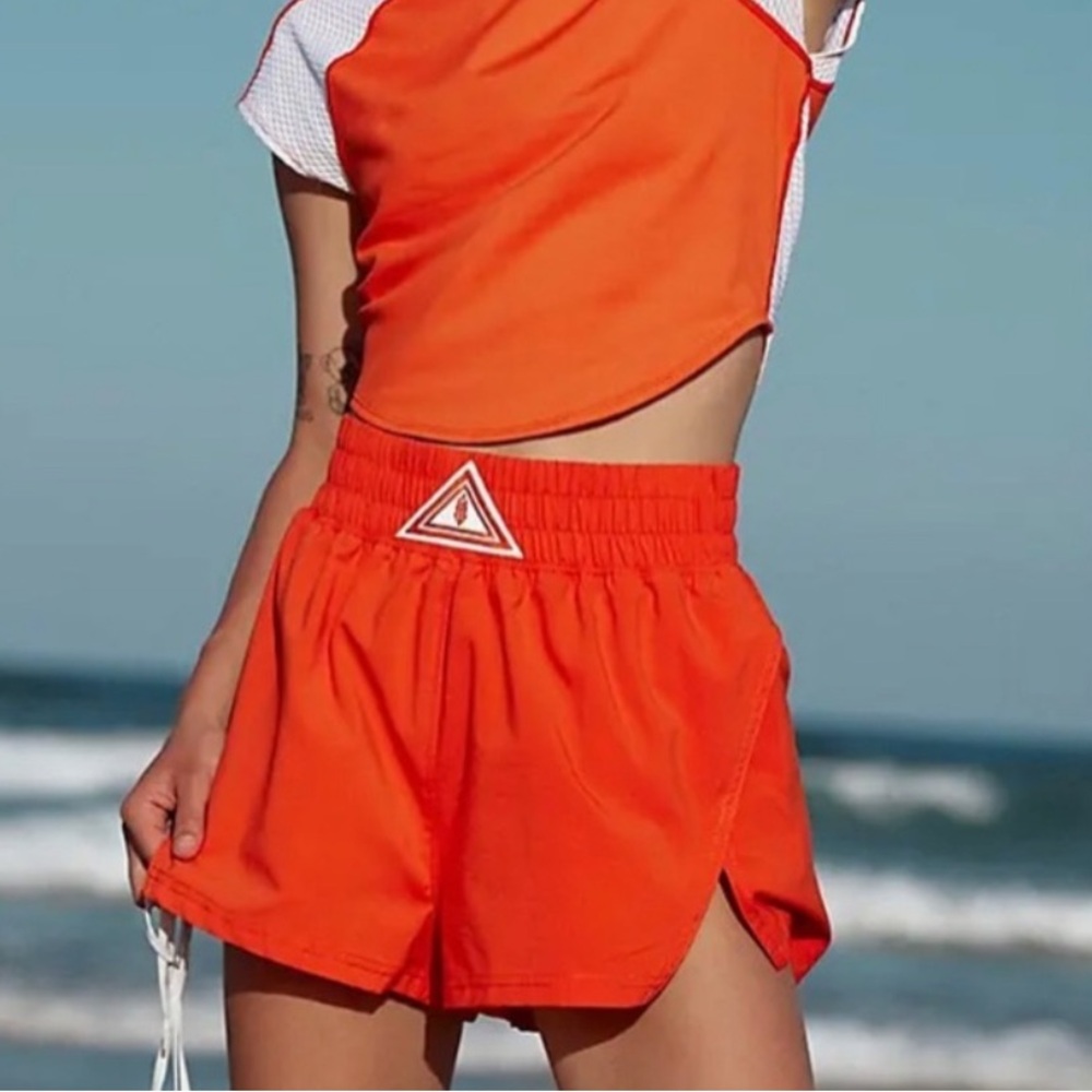 Free people movements next round orange shorts Xs